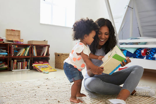 Mum and toddler share a book, boosting language skills