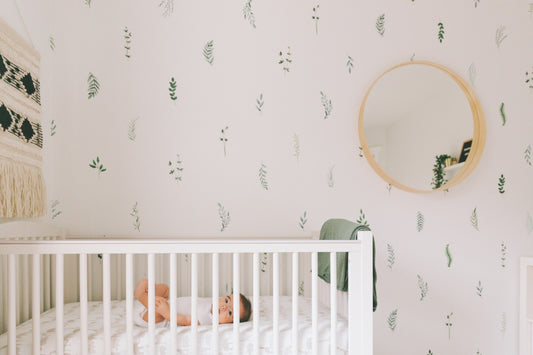 baby-in-nursery-with-nature-wallpaper