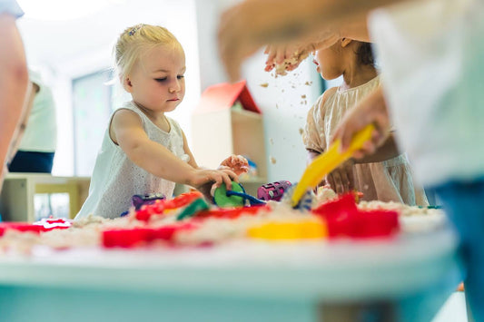 Toddlers playing on their first day of daycare