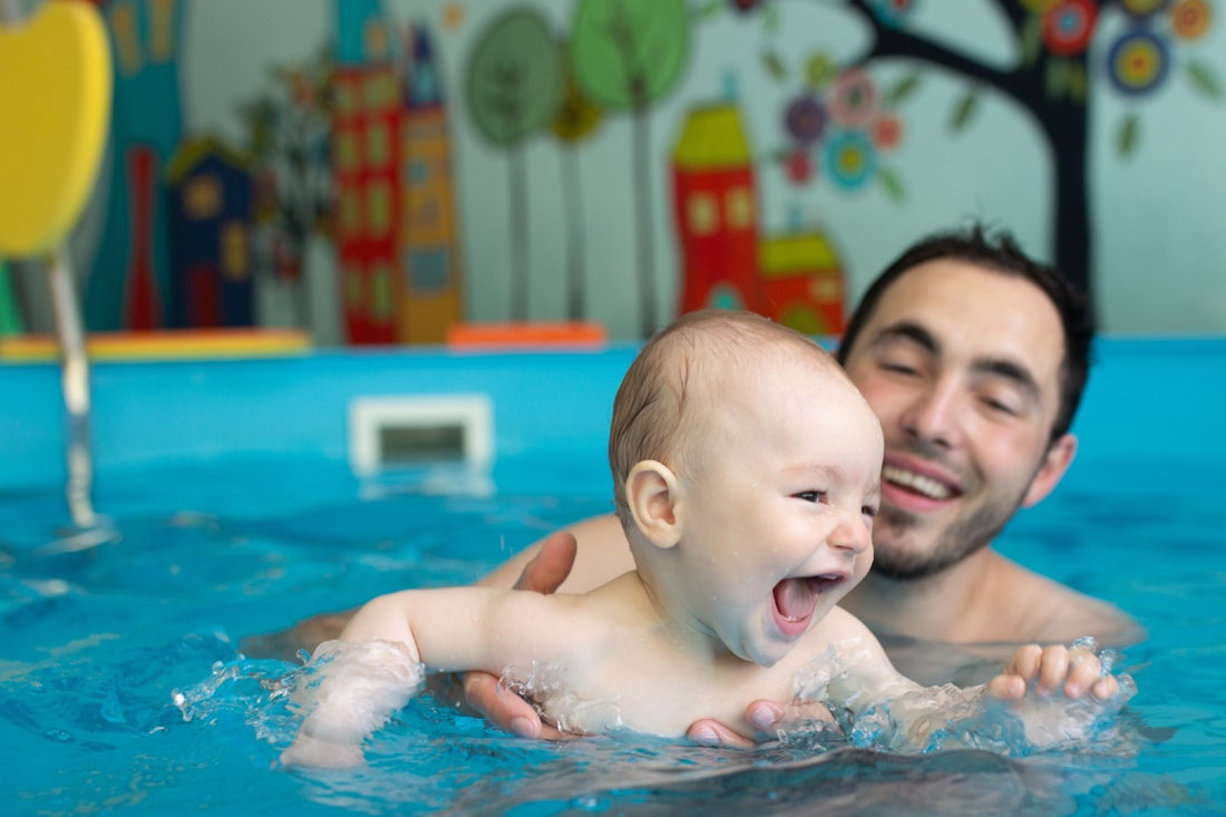 Baby and adult at baby swim lessons