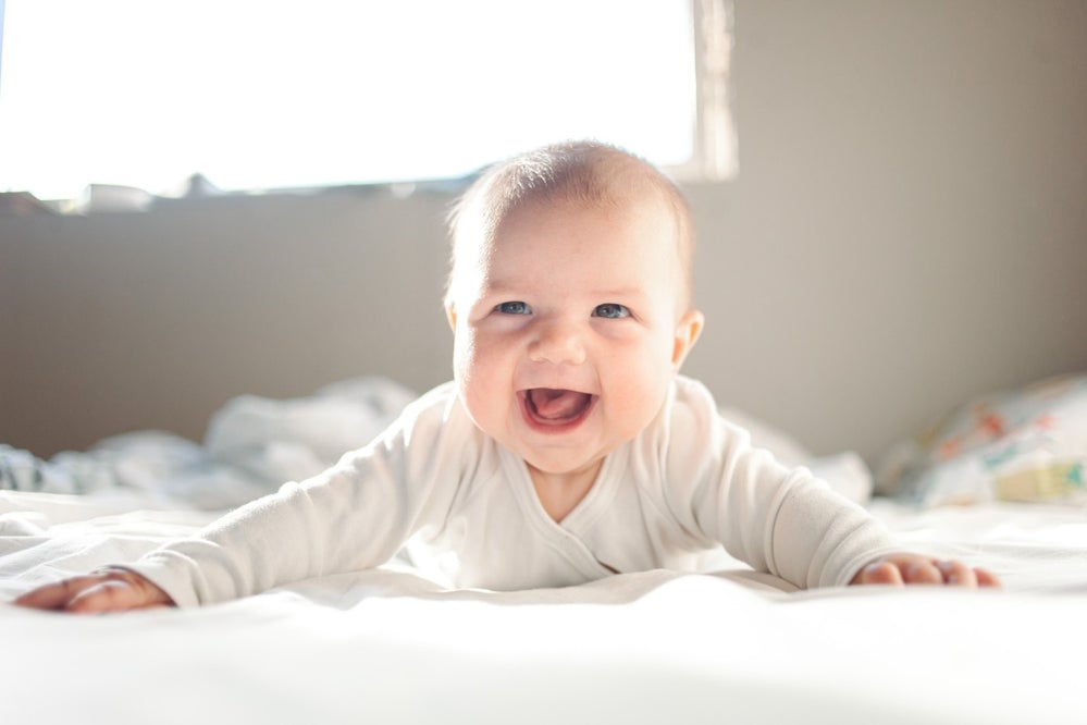 Baby laughing during tummy time 