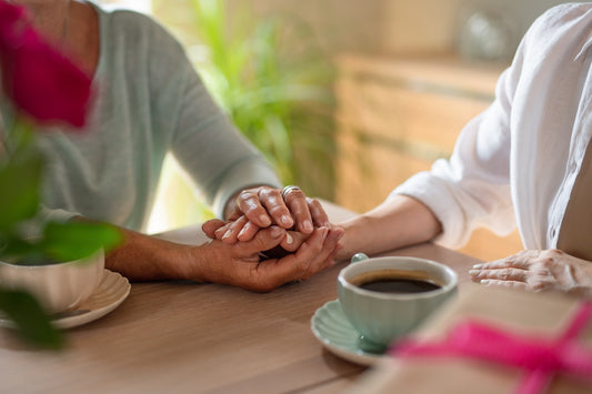 A woman comforts a friend coping with pregnancy loss