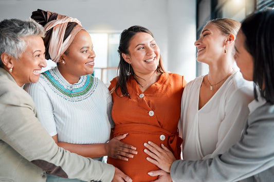 Women gather around a pregnant mum at a nesting shower