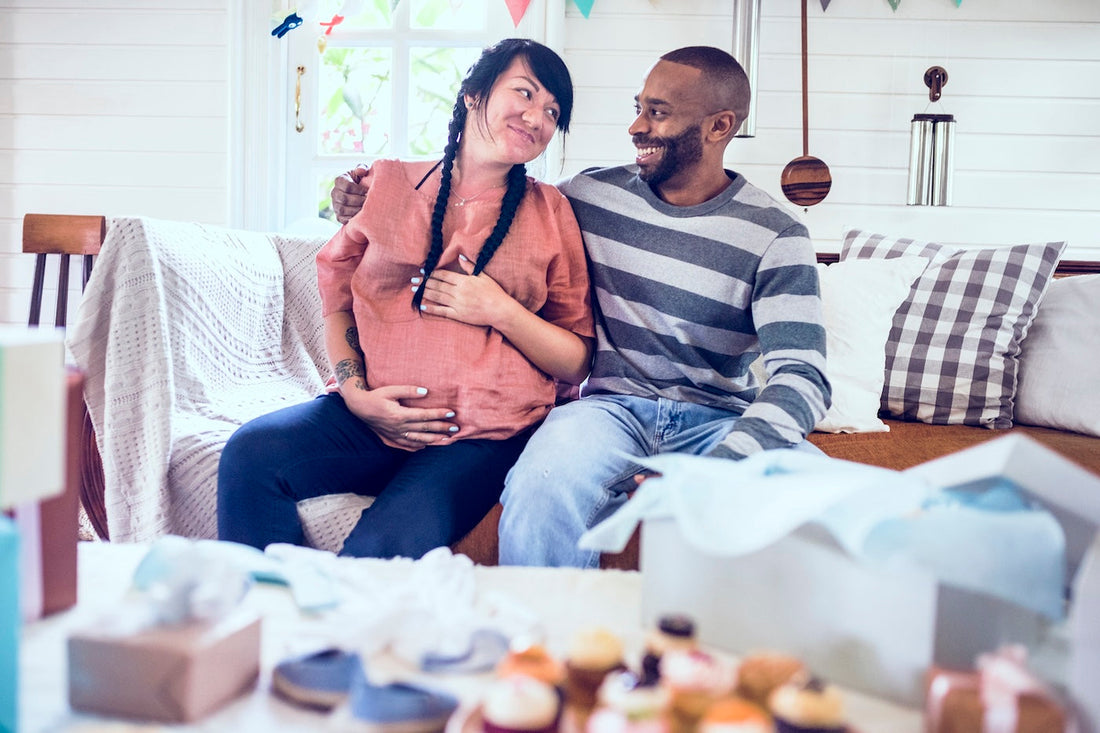 An expecting mum and dad sit together