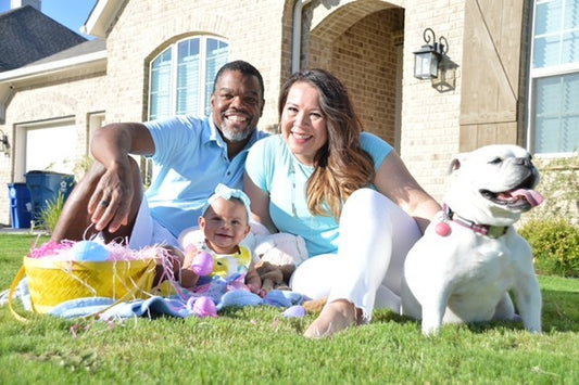 SNOO review: Mum, dad, baby, and dog posing for a picture outside