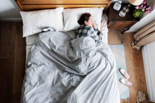 sleep for mental health: woman sleeping in bed