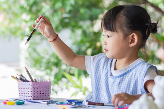 Child learning to draw