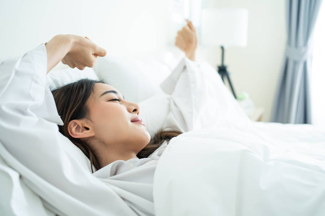 Mum waking up refreshed after getting enough sleep
