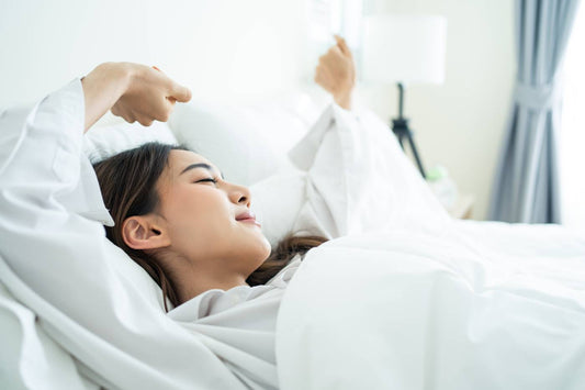 Mum waking up refreshed after getting enough sleep